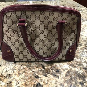 Burgundy Gucci dome bag.